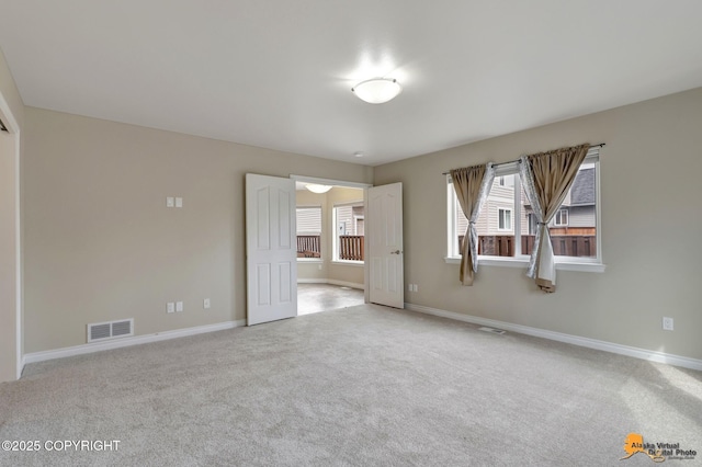 1091 Northpointe Bluff Dr, Anchorage, AK 99501 - carpeted empty room with baseboards