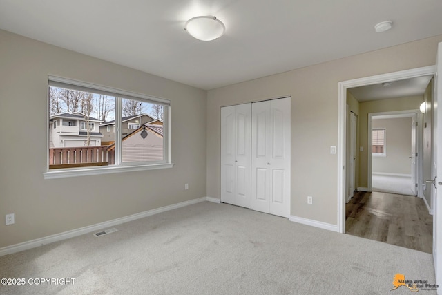 1091 Northpointe Bluff Dr, Anchorage, AK 99501 - unfurnished bedroom featuring carpet flooring and a closet