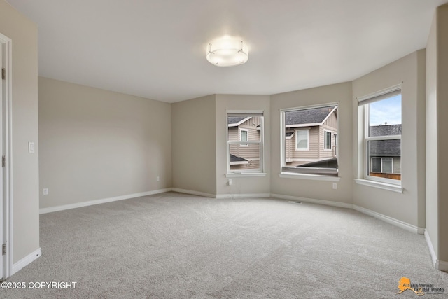 1091 Northpointe Bluff Dr, Anchorage, AK 99501 - empty room featuring carpet and baseboards