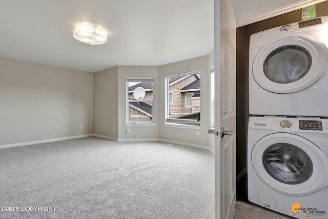 1091 Northpointe Bluff Dr, Anchorage, AK 99501 - washroom with stacked washer / dryer and carpet