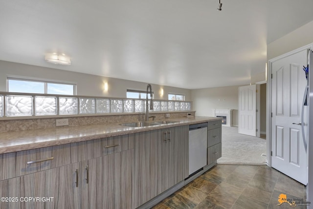 1091 Northpointe Bluff Dr, Anchorage, AK 99501 - kitchen with dishwashing machine, plenty of natural light, light stone countertops, and open floor plan