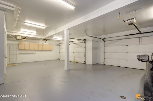 1091 Northpointe Bluff Dr, Anchorage, AK 99501 - garage featuring a garage door opener and baseboards