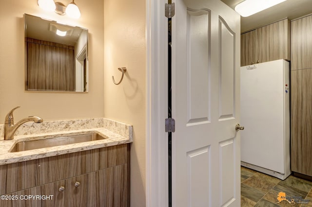 1091 Northpointe Bluff Dr, Anchorage, AK 99501 - bathroom featuring vanity and stone finish floors