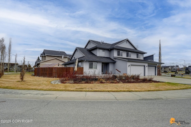 1091 Northpointe Bluff Dr, Anchorage, AK 99501 - traditional-style house with driveway, an attached garage, and roof with shingles