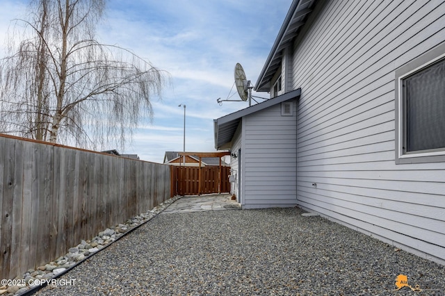 1091 Northpointe Bluff Dr, Anchorage, AK 99501 - view of home's exterior featuring a patio area