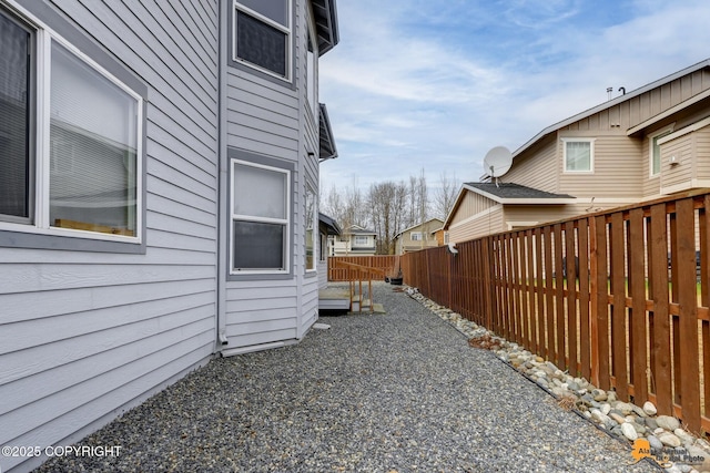 1091 Northpointe Bluff Dr, Anchorage, AK 99501 - view of property exterior with a fenced backyard