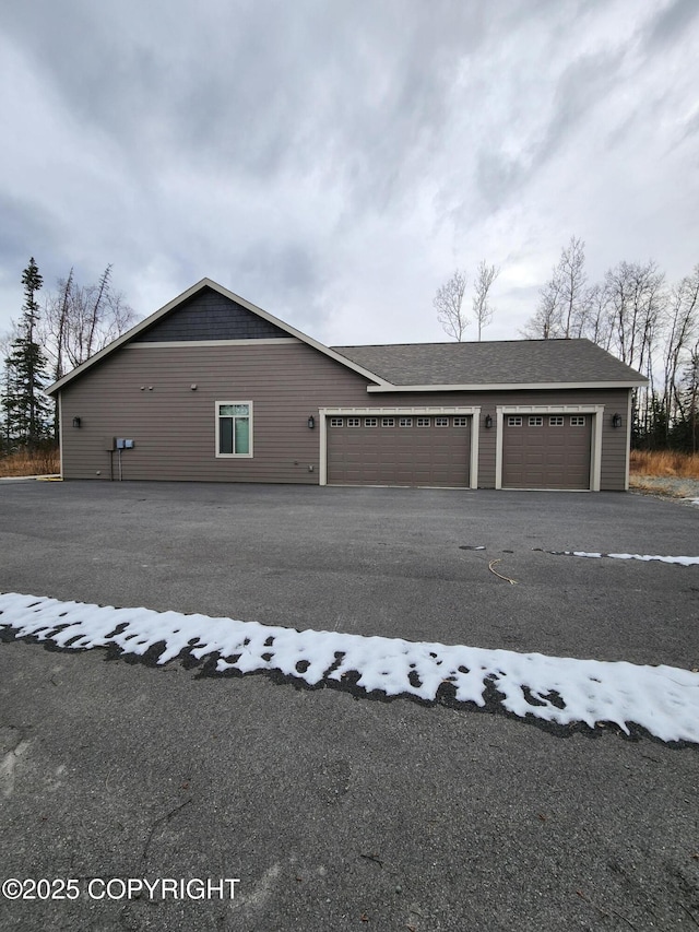 view of property exterior featuring a garage