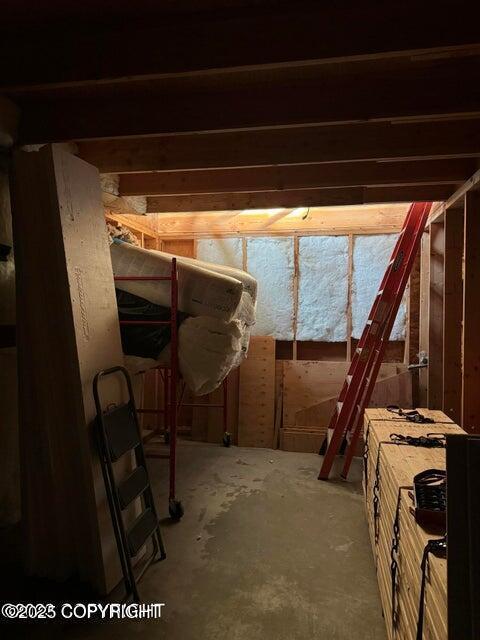 miscellaneous room featuring unfinished concrete flooring