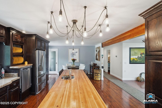 19136 S Birchwood Loop Rd, Chugiak, AK 99567 - dining room with baseboards, dark wood-style floors, and a chandelier
