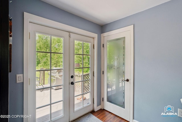 19136 S Birchwood Loop Rd, Chugiak, AK 99567 - doorway to outside featuring french doors, dark wood finished floors, and baseboards