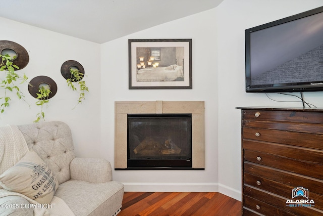 19136 S Birchwood Loop Rd, Chugiak, AK 99567 - living area with lofted ceiling, wood finished floors, baseboards, and a fireplace