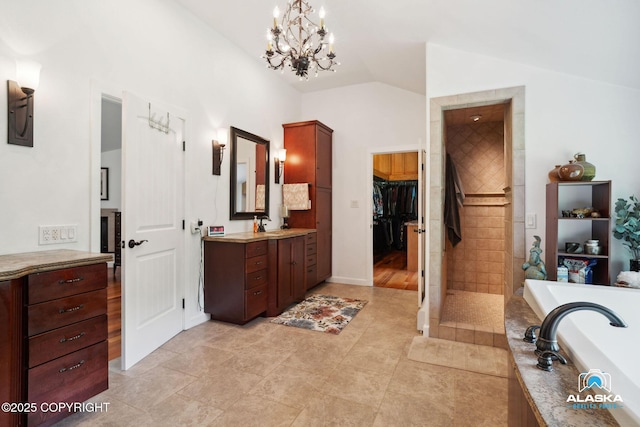 19136 S Birchwood Loop Rd, Chugiak, AK 99567 - bathroom featuring vanity, a garden tub, vaulted ceiling, a chandelier, and a tile shower