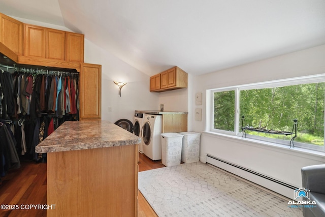 19136 S Birchwood Loop Rd, Chugiak, AK 99567 - kitchen with independent washer and dryer, a baseboard radiator, vaulted ceiling, a kitchen island, and dark wood-style floors