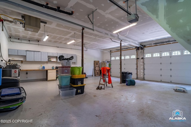 19136 S Birchwood Loop Rd, Chugiak, AK 99567 - garage with a garage door opener and a heating unit
