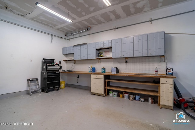 19136 S Birchwood Loop Rd, Chugiak, AK 99567 - garage featuring a workshop area