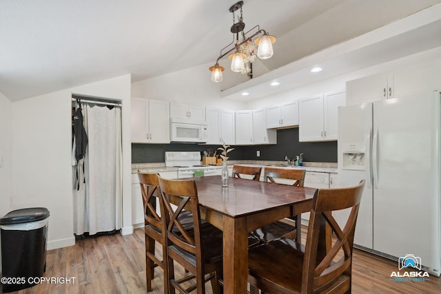 19136 S Birchwood Loop Rd, Chugiak, AK 99567 - dining room featuring light wood finished floors, recessed lighting, and high vaulted ceiling