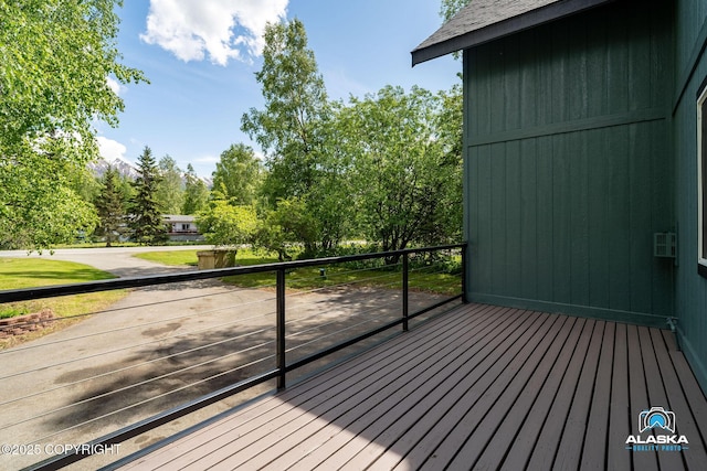 19136 S Birchwood Loop Rd, Chugiak, AK 99567 - wooden deck featuring view of wooded area
