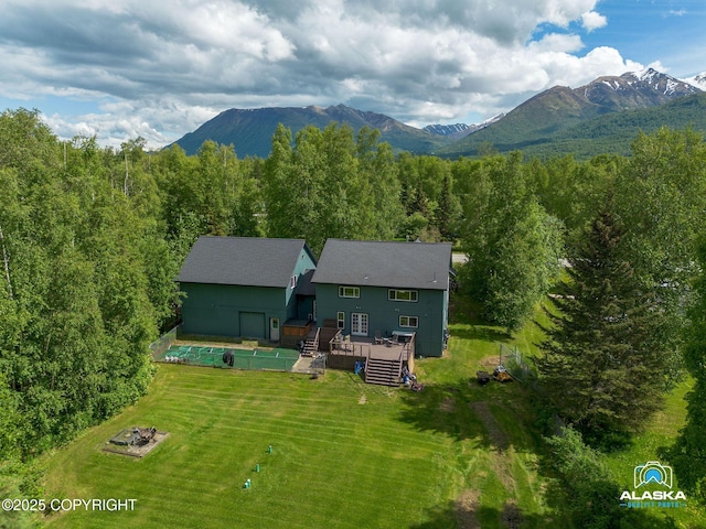 19136 S Birchwood Loop Rd, Chugiak, AK 99567 - view of subject property with a mountainous background and a forest