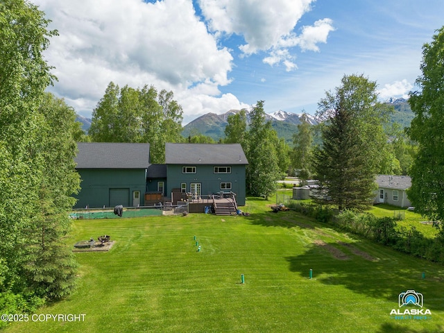 19136 S Birchwood Loop Rd, Chugiak, AK 99567 - back of house featuring a deck with mountain view