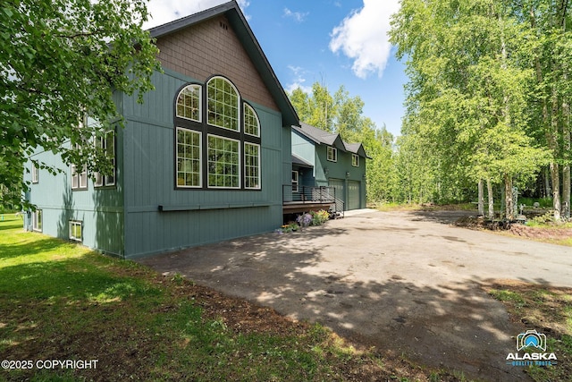 19136 S Birchwood Loop Rd, Chugiak, AK 99567 - view of home's exterior with driveway and a garage