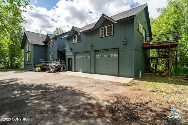 19136 S Birchwood Loop Rd, Chugiak, AK 99567 - view of front of house featuring stairs, asphalt driveway, a shingled roof, and a wooden deck
