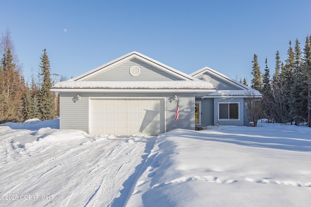 ranch-style house featuring an attached garage