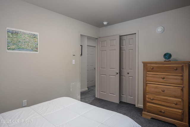 bedroom featuring a closet and dark carpet