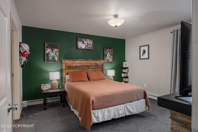 bedroom featuring a baseboard heating unit, baseboards, and carpet