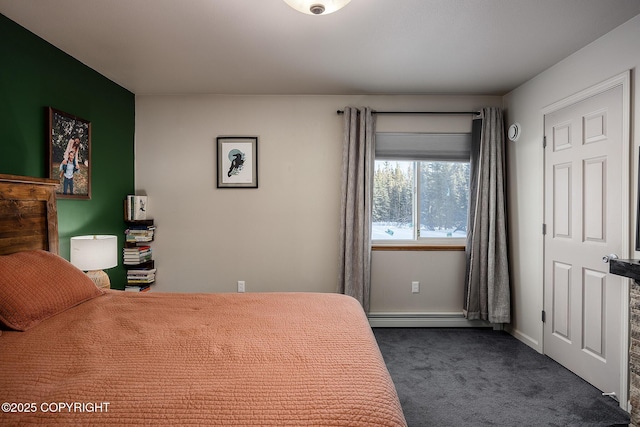 bedroom with dark colored carpet and a baseboard radiator