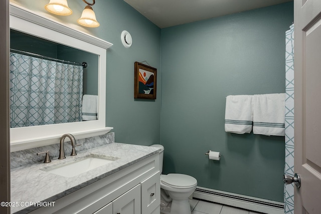 bathroom with tile patterned flooring, toilet, vanity, and a baseboard radiator