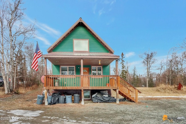 view of front of property with covered porch and metal roof