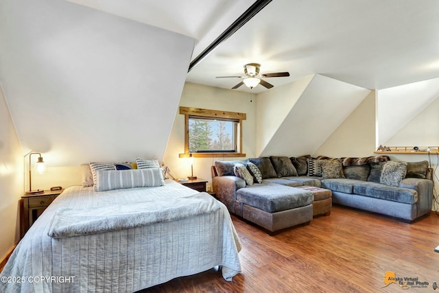 bedroom featuring wood finished floors, a ceiling fan, and vaulted ceiling