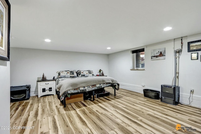 bedroom with recessed lighting, baseboards, and light wood-style floors