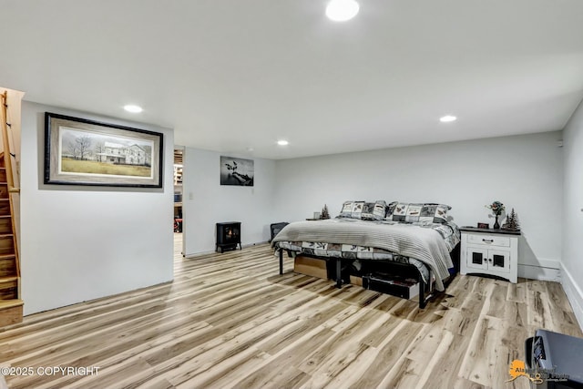 bedroom featuring recessed lighting, light wood-type flooring, and baseboards