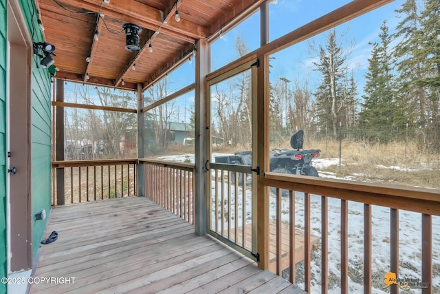 unfurnished sunroom with wooden ceiling