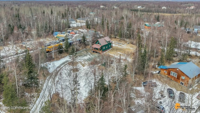 drone / aerial view featuring a forest view