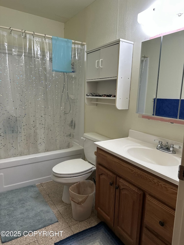 bathroom with vanity, toilet, and shower / tub combo