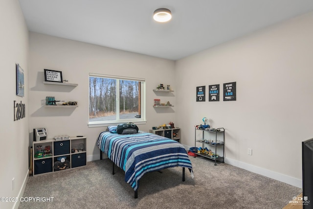 carpeted bedroom with baseboards