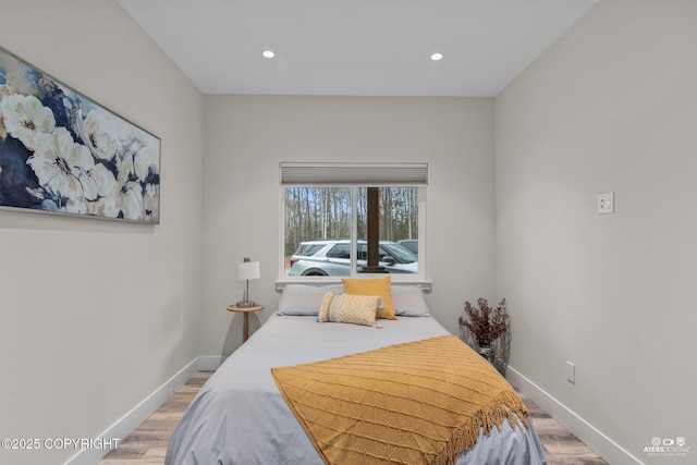 bedroom featuring recessed lighting, baseboards, and light wood-style flooring