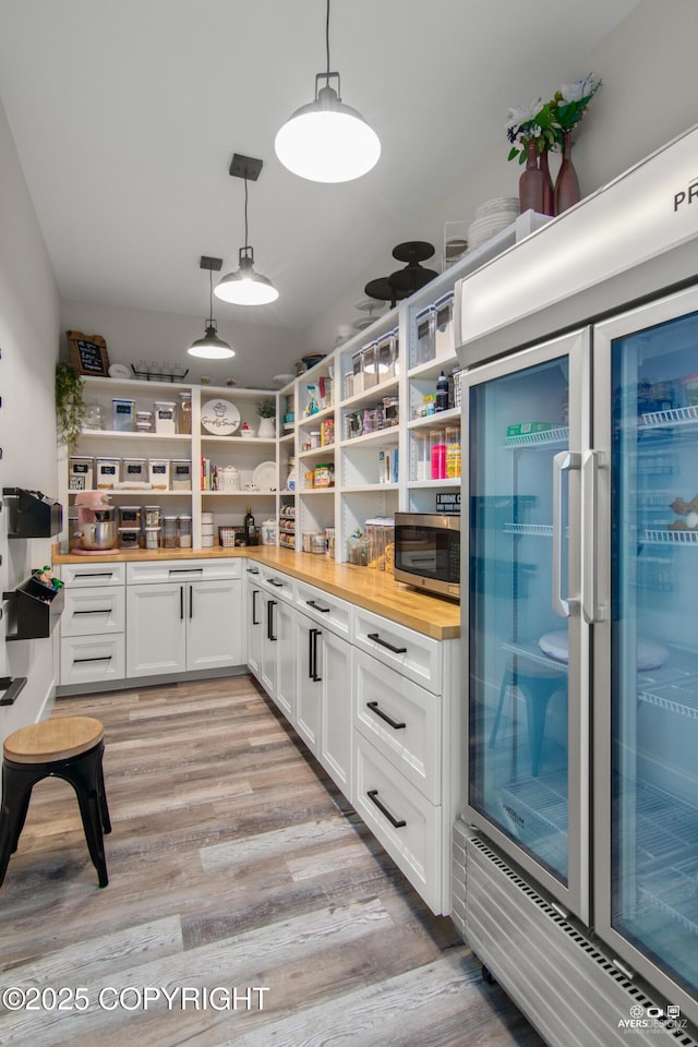 pantry featuring wine cooler