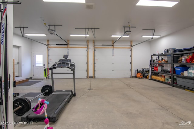 garage featuring a garage door opener