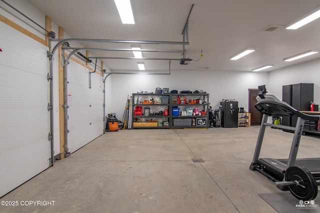 garage featuring a garage door opener