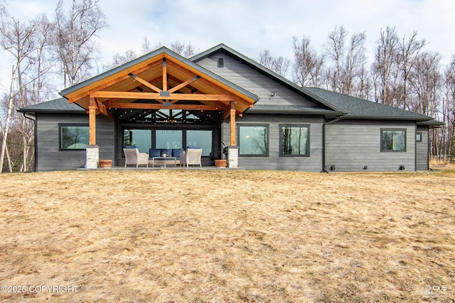 back of house featuring a patio area and an outdoor hangout area