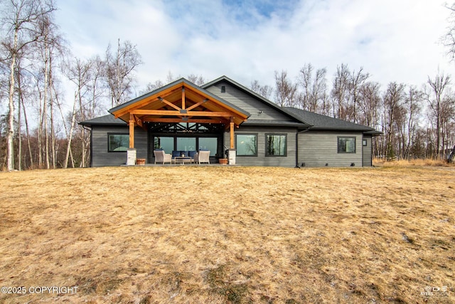 rear view of property with a patio area