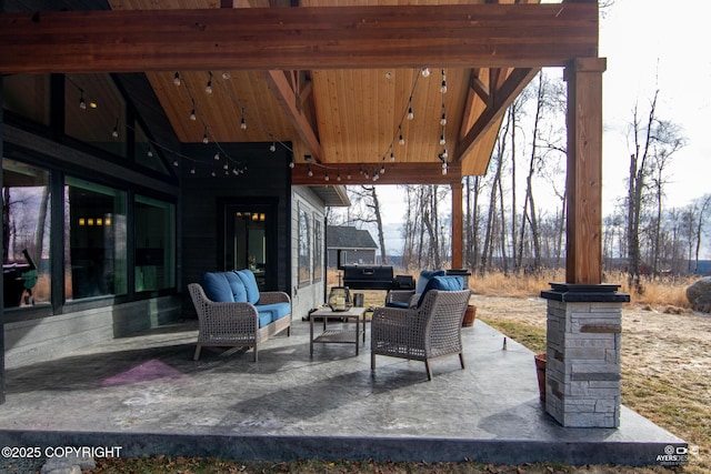 view of patio with outdoor lounge area and grilling area