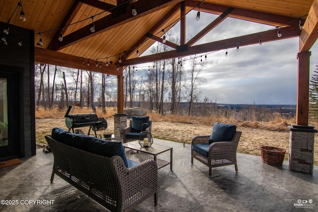 view of patio with outdoor lounge area and a gazebo