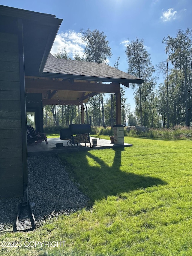 view of community featuring a gazebo, a lawn, and a patio area