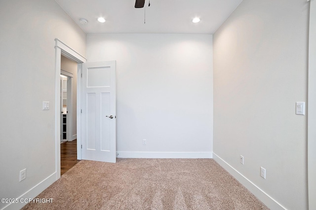 carpeted empty room featuring recessed lighting, ceiling fan, and baseboards