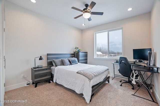 bedroom featuring a ceiling fan, recessed lighting, light colored carpet, and baseboards