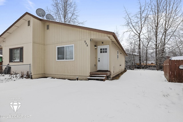 view of front of home featuring fence